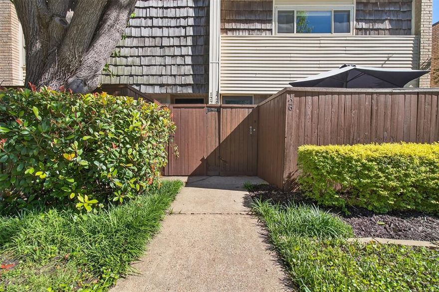 Comfortable. Fresh. Convenient. 2702 Douglas #126 is an end unit townhome located a few minutes walk to Kroger, eateries and shops. The home is set back from Douglas offering a quiet indoor atmosphere. Walk up to #126 and you are greeted by an inviting patio complete with a secure storage shed. Inside, you will find a smart, efficient floor plan that gives you space where you need it the most. The main level features a spacious kitchen, half bath, laundry, dining area, living room and handy storage spaces. Go out the back door for easy access to the gated parking area that includes one carport space and some unassigned parking. Upstairs features 2 spacious bedrooms with walk in closets, bright windows and an oversized bathroom. The monthly assessment includes exterior insurance, water, trash, landscaping and exterior maintenance. Owner pays electric, internet and interior insurance. Come tour this unique, inviting condo at one of our many open houses or schedule your showing today!