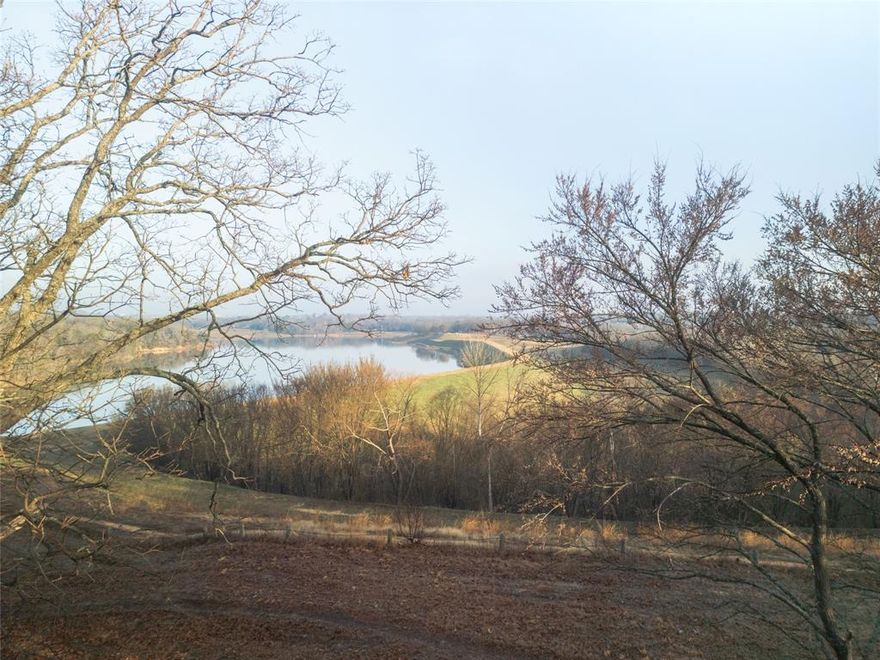 Experience Denison's most spectacular vista on this build-ready lot overlooking Waterloo Lake. Wake up to panoramic water views from your future back porch while maintaining the natural beauty of mature trees throughout the property.

The location offers unparalleled lifestyle advantages: a scenic walking trail runs directly behind the lot, wrapping around the lake and connecting to Waterloo Park's amenities—playground, horseshoe pits, and dog park—plus direct access to the newly developed Katy Trail.

This lot provides the perfect canvas for your custom dream home, combining the tranquility of waterfront living with convenient recreational access. Don't miss this rare opportunity to build your ideal retreat in one of Denison's most coveted locations.