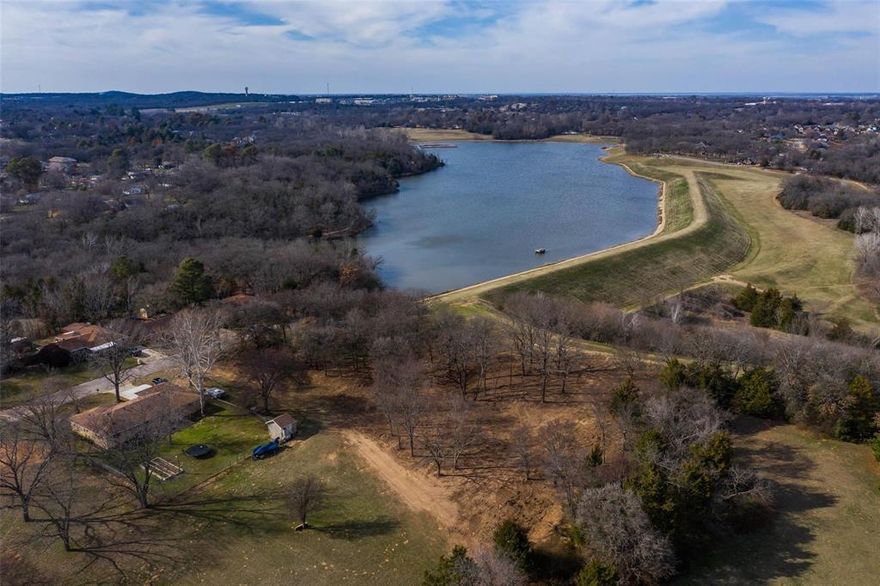 Experience Denison's most spectacular vista on this build-ready lot overlooking Waterloo Lake. Wake up to panoramic water views from your future back porch while maintaining the natural beauty of mature trees throughout the property.

The location offers unparalleled lifestyle advantages: a scenic walking trail runs directly behind the lot, wrapping around the lake and connecting to Waterloo Park's amenities—playground, horseshoe pits, and dog park—plus direct access to the newly developed Katy Trail.

This lot provides the perfect canvas for your custom dream home, combining the tranquility of waterfront living with convenient recreational access. Don't miss this rare opportunity to build your ideal retreat in one of Denison's most coveted locations.
