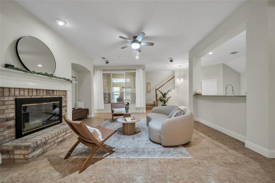 Your new home, where style meets comfort in this 4 bedroom 2 bath home. The open layout flows effortlessly between inviting living areas, each framed by tasteful finishes and abundant natural light. The kitchen’s expansive island built for connection, combines practical design with timeless beauty. Upstairs, unwind in the game room or step out and enjoy peaceful mornings on the balcony, cozy afternoons by the fireplace, and evenings entertaining in the spacious backyard.. From the welcoming front porch to the lush backyard, this home is creates a sense of ease and warmth you’ll love coming home to.