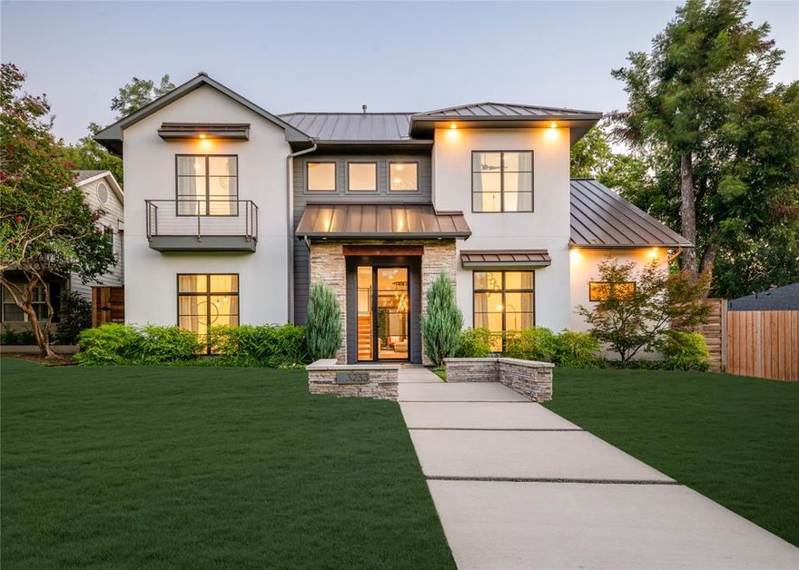 Step into luxury living with this architectural gem on an expansive 70’-wide lot in University Park—tucked behind the wall on a quiet cul-de-sac street, just a short walk to Boone Elementary in HPISD. Custom-built by Anderson Homes, this transitional modern showplace is the ultimate expression of luxury, design and craftsmanship. A dramatic La Cantina glass entry leads to soaring ceilings, natural textures, and sleek architectural lines—flooded with natural light and layered in rich designer detail. Every element is curated: from the 6” white oak floors and Jeld-Wen wood-clad windows and doors to walnut-accented cabinetry, quartz and porcelain tile surfaces and designer lighting. The seamless indoor-outdoor flow elevates both daily living and entertaining. At the heart of the home, the open-concept great room is anchored by a sleek linear fireplace and a dramatic Restoration Hardware chandelier—framed by sliding glass doors that open wide to the terrace and backyard oasis beyond. This intentional indoor-outdoor connection transforms the space, merging relaxed elegance with effortless entertaining. The great room flows into a chef’s kitchen–complete with oversized quartz waterfall island, premium Thermador appliances, custom cabinetry, and a sunlit dining area. Also on the main level: a serene primary suite with a spa-worthy bath and boutique-style walk-in closet, a private guest suite, and a dedicated study. Upstairs, three spacious ensuite bedrooms connect to a large game room with wet bar and sliding doors to a covered balcony—an elevated retreat for morning coffee or evening cocktails–and a media room offers the ultimate cinematic experience. The illuminated backyard—designed by Radiant Gardens and Southern Botanical—is a private retreat with a covered terrace and open patio with cedar-shaded arbor, dramatic trickling wall fountain, and a turfed lawn ready for a future pool. Rare in both scale and sophistication, this home defines luxury in the heart of HPISD.
