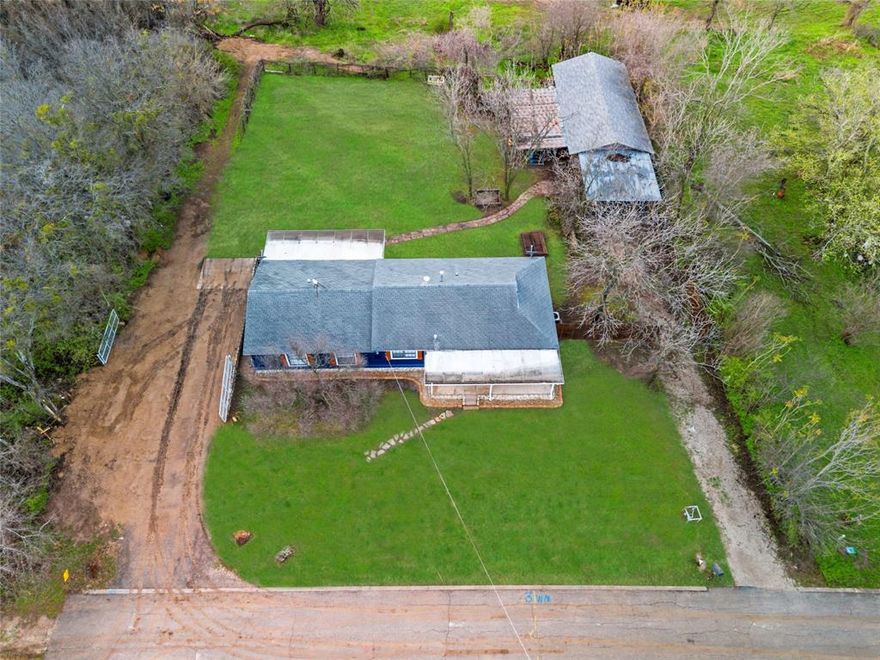 Beautifully updated, single family, ranch style home! Tucked away on the end of private cul de sac in Aledo ISD. This home is open concept with original hardwood floors. There are amazing touches throughout,  from decorative bead board to custom wood work on the ceilings.  Kitchen has a huge island with a sink in it and tons of storage. Stainless appliances and farmhouse sink. Tons of natural light throughout home.  Both bathrooms have been updated, including granite countertops, and the master bathroom has a fantastic clawfoot tub.  There is a large laundry room with tons of pantry space and storage. Home sits on just under an acre of land. There is a 756 sq. ft. workshop with electric run to it with a large covered patio and covered carport attached to it. There is are 2 additional covered patios, one on the front and one on the back of the house. Back yard is huge and partially fenced. There are two driveways, one on each side of the home.  City just updated the gas lines in the neighborhood so grassy area in the front yard hasn't grown back yet.  No neighbors behind or to the south just open space. Roof is scheduled to be replaced in the next few weeks.