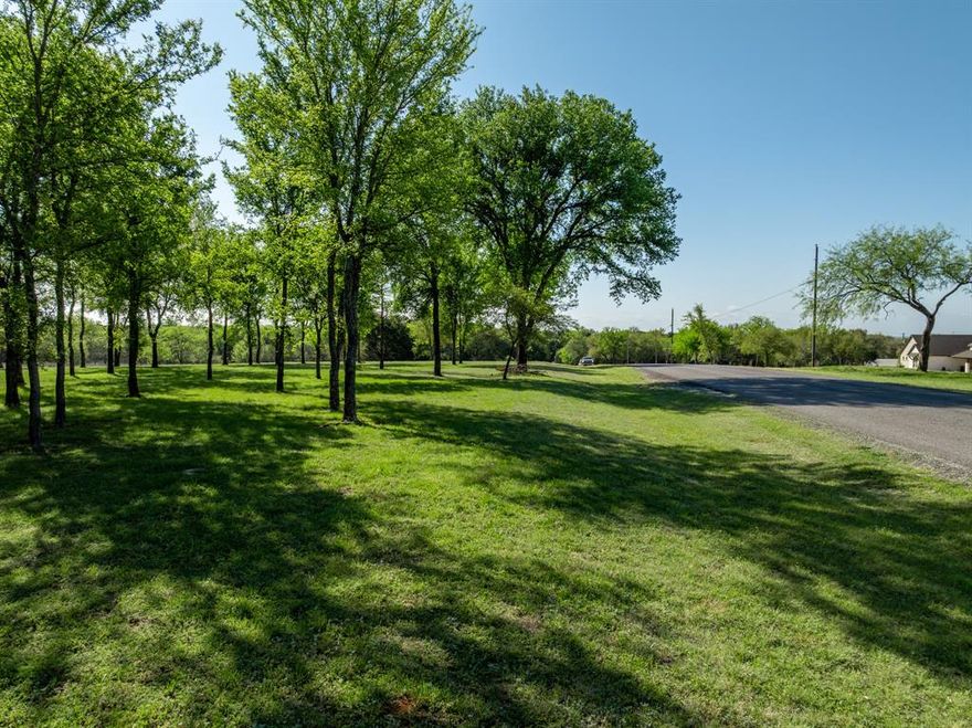 Discover a heavily treed, cleared, and build-ready lot spanning .96 acres on White Bluff Dr. in the exclusive gated community of White Bluff Resort on Lake Whitney.  Enjoy abundant wildlife, breathtaking starry skies, and peaceful country living, all with the convenience of an easy commute to the DFW and Waco Corridor. Residents have access to two 18-hole championship golf courses, marina, four pools, tennis-pickle ball courts, parks, playground and more.  Plus the added benefit of a free golf membership and 36 rounds of green fees per year transfer to new owner at closing.  The community features a 24-hour manned front gate and patrol.  This property offers the perfect balance of natural beauty and modern amenities for your dream home.