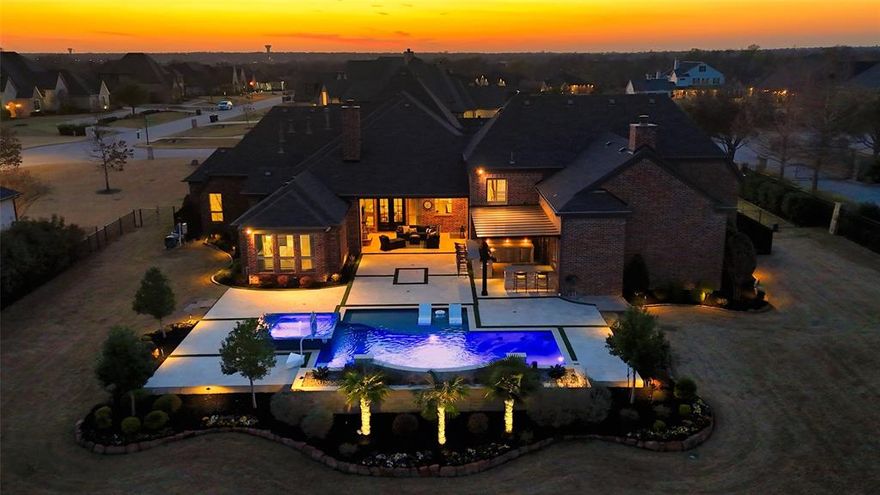 Rare opportunity to own a one story custom estate on an acre inside the private gates of Christie Farms with over $460K+ of upgrades. Situated on a beautifully landscaped homesite, 1720 Aspen presents a refined blend of luxury, privacy, and resort style living. As you arrive, extensive landscaping enhancements create an immediate sense of arrival, framing the property with mature greenery, exceptional curb appeal, and privacy.

Inside, nearly 5,000sf unfolds across a single level, a rare layout in Prosper luxury living. Four spacious bedrooms feature private ensuite baths and custom closets, while the primary suite showcases wood beams, natural light, and a professionally designed closet. Dramatic ceilings, oak floors, and statement fireplaces anchor the main living spaces, complemented by solid core doors and timeless craftsmanship throughout.

The refreshed kitchen features a commercial gas rangetop and updated finishes, designed as both a functional workspace and gathering space. A stunning 1,100 bottle wine cellar and integrated Sonos audio flow throughout the interior, outdoor living areas, garages, and motor court.

Step outside and the estate transforms into a private backyard retreat. Over $325K has been invested in the outdoor experience, featuring a resort style pool and spa, outdoor kitchen and bar, covered living with fireplace, and a motorized shade for year round enjoyment.

Additional highlights include four garages with epoxy floors and custom storage, porte-cochere, basketball and motor court, and access to the community pond where residents enjoy fishing and scenic views.

An additional 800sf of unfinished walk in attic space provides exceptional flexibility for a future 5th bedroom, office, gym, game room, golf simulator, or storage.

This gated one story estate represents one of the most complete luxury opportunities currently available in Prosper.