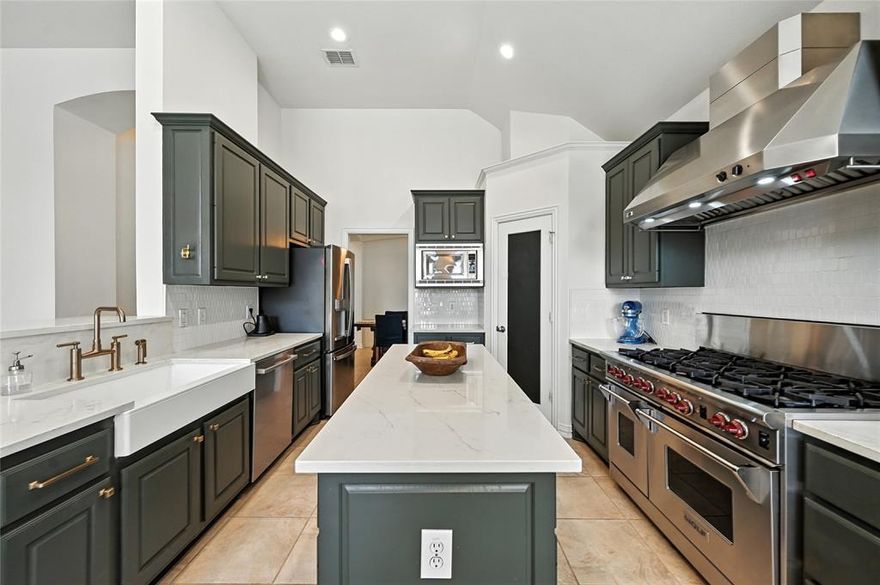 SPRAWLING SINGLE-STORY with a 3 CAR GARAGE in HIGHLY SOUGHT-AFTER WELLINGTON! Fall in love with this warm & inviting floor plan graced with tall ceilings, decorative lighting, updated ceiling fans, built-in speakers & a home office showcasing walls of built-ins, plus a recently replaced roof & furnace. Inspire your inner chef in the beautifully remodeled kitchen featuring upgraded countertops, a 48 in. Wolf range with 8 burners & dual ovens, a farmhouse sink, decorative backsplash, island & a walk-in pantry. Unwind in the cozy family room boasting a built-in entertainment center with a fireplace, or end your day in the large primary suite including a dual sink vanity, soaking tub, separate shower & a walk-in closet. Enjoy the convenience of a well-appointed laundry room complete with a fireclay sink, marble countertops, tons of built-in cabinets & a pantry with pull-out drawers, or spend time outdoors in your spacious backyard offering a huge pergola covered patio with a porch swing, lush landscaping & plenty of room to play. Close proximity to top-rated schools & Wellington amenities, including pools, playgrounds, tennis courts, pickleball, volleyball, basketball, a 3-hole putting green, 9-hole disc golf, a fitness center, lakes, miles of trails & more!