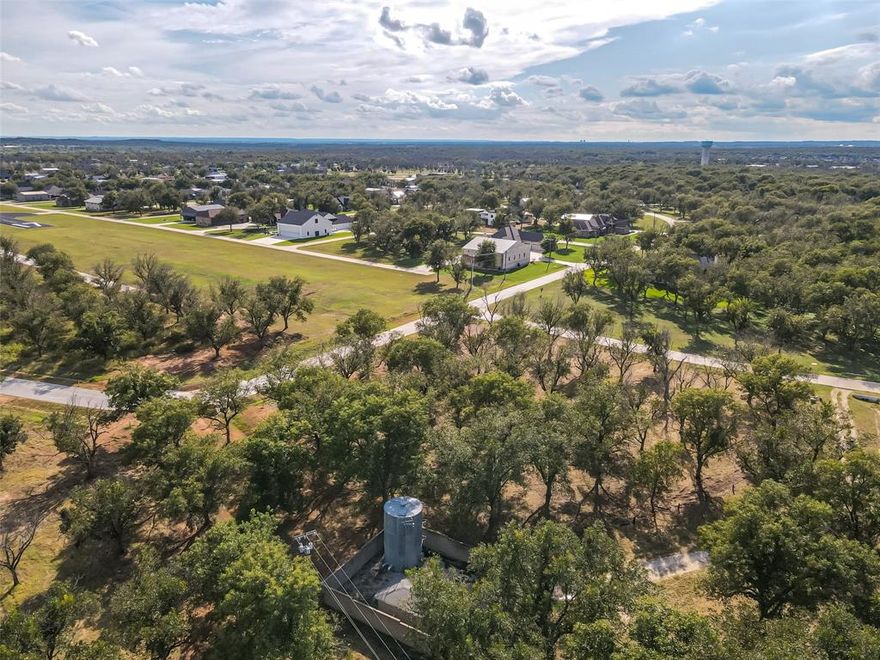 A spacious 1.9 acre lot located on the edge of The Retreat area of Pecan Plantation.  This property offers a private setting with plenty of room to build your dream home.  Conveniently located next to an additional 1.6 acre lot (listed separately), this property gives buyers the rare opportunity to purchase both and combine them into a 3.5 acre estate sized homesite  Enjoy all the amenities of Pecan Plantation including golf, clubhouse, parks, air park, and more while having extra space and flexibility for your future.  Drone photos coming soon!
