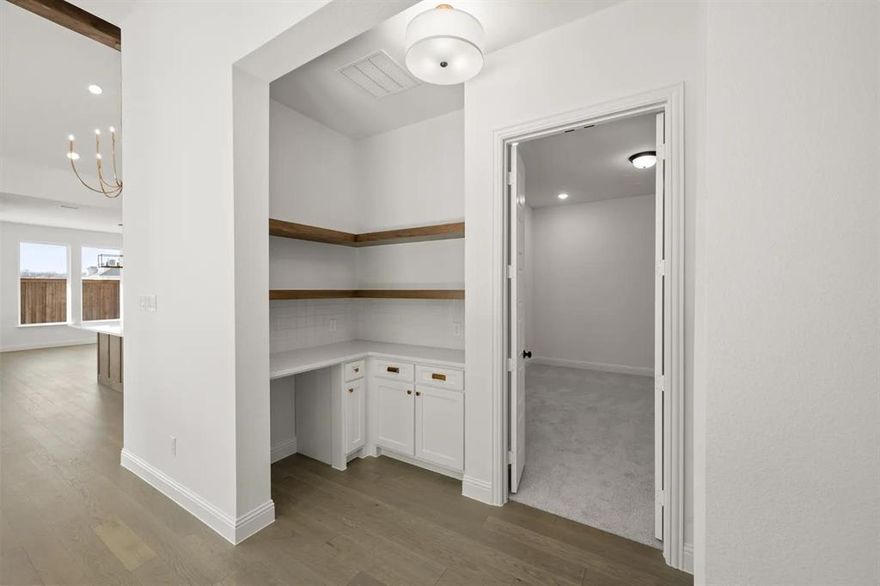 MLS# 21115914 - Built by Drees Custom Homes - Ready Now! ~ The Gabriella is a lovely one story home in Viridian Elements. When entering the home, two secondary bedroom ensuites rest off the foyer. The hallway passes the study, media room, wine bar and courtyard before entering the open family room and kitchen. The family room offers a seamless transition through a beautiful sliding glass door to another outdoor living space with an outdoor grill. Enjoy maximum privacy at the back of the home in your luxurious primary suite.