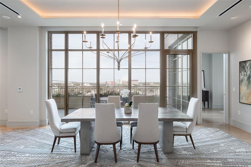 This exquisite home in The Terminal at Katy Trail was designed by acclaimed interior designer Gonzalo Bueno of X+III and is one of only three combined units in the building. The residence occupies the entire west side of the fifth floor, with views of downtown, the Katy Trail, and the Knox Street area. The expansive floor plan provides large open living areas with multiple seating areas and a wet bar for sophisticated entertaining. The dining room opens to a 499-square-foot-terrace overlooking the Katy Trail. The gourmet kitchen is well-equipped with Miele appliances, including a gas range. The spacious primary suite with downtown views includes a sitting area, a beautifully appointed bathroom opening to a terrace, an enormous closet, and coffee bar.  Three secondary bedrooms are located on the north end of the residence, all with en-suite bathrooms and large closets. There is also a study with views of the Katy Trail. The Terminal at Katy Trail, designed by Austin-based architect Michael Hsu, also offers fabulous amenities such as yoga, Pilates, delicious dining options, 24-hour concierge, valet, and a state-of-the-art health and wellness day spa.