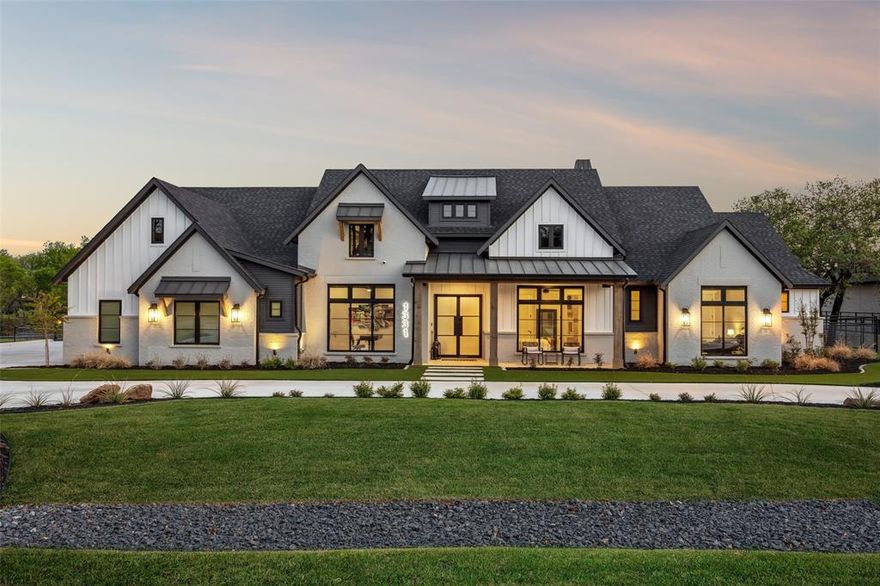 Tucked within the exclusive Creekview Ranch, this masterfully designed single-story estate blends sophistication with effortless luxury spanning 3,859 sq. ft. (or 4,159 sq. ft. with the private gym). This custom-built sanctuary sits on 1.01 acres of lush, professionally landscaped grounds, offering an unparalleled living experience. Beyond the grand iron doors, the home unfolds with white oak flooring, quartz countertops, and custom white oak cabinetry—all framed by exposed ceiling beams and paneled accent walls. The chef’s kitchen is a vision of form and function, featuring a 48” Jenn-Air gas range, a striking white oak hood, and an oversized island, all complemented by illuminated glass cabinetry, a hidden coffee station, and an expansive pantry with sliding shelves. Each of the four en-suite bedrooms is complete with walk-in closets. The primary suite is a sanctuary of comfort, while the second master retreat offers bespoke built-ins, a soaking tub, and designer finishes. The game room flows seamlessly to the outdoors, and a blackout-shaded media room transforms any evening into a cinematic experience. The backyard is a resort-style outdoor escape, featuring a PebbleTec pool with three waterfalls, a raised spa, and a fire pit along the water’s edge. A fully equipped outdoor kitchen, wood-burning fireplace, and pergola with patterned turf steps complete the perfect setting for entertaining or quiet relaxation. For the fitness enthusiast, a dedicated gym boasts Olympic-grade rubber flooring, a 16-ft Anderson slider, integrated speakers, and full-length mirrors. The home is wired for modern living, motorized interior and patio shades, and a built-in bar with dual kegerator and illuminated shelving. The three-car garage features custom cedar doors and epoxy flooring. From the Anderson and Western stacking doors that blur the lines between indoors and out, every detail of this home has been designed to elevate modern luxury.