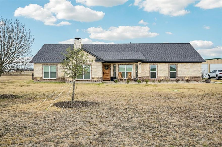 Beautiful single story home on two acres! Plenty of room to roam. The two acres can be separated into two parcels. A one acre plot is ready to build on with separate water already on site. Enjoy no HOA and low county property taxes. Wood look luxury vinyl floors adorn the entire home. Very open floor plan with family room featuring a corner fireplace with stone hearth. Stylish kitchen with two tone cabinetry, tile backsplash, cabinet hardware, granite counters, open island, stainless appliances, 5 burner cooktop, and steel vent. Primary Bedroom is perfect for king size furniture. Primary bath with dual sinks, garden soaking tub, & shower. The fourth bedroom with en-suite bathroom is the size of a second master. Backyard with covered patio is perfect for outdoor living & entertaining. The 864 square feet garage with workshop is perfect for all your garage needs. There is plenty of space to add a third garage door to convert it into a three car garage if desired. This home is a MUST SEE!