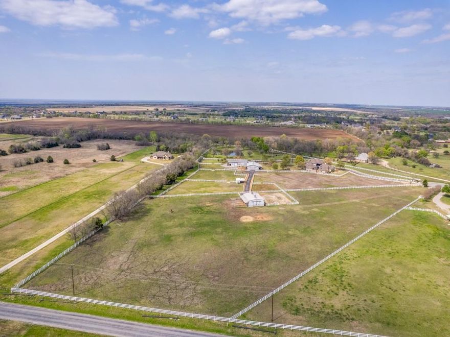 Rare opportunity to own 5.29 acres in the highly sought after Hidden Lakes community in Gunter, Texas, offering the perfect setting to build your dream home in one of North Texas’ fastest growing areas. Tucked on a quiet cul-de-sac street and located outside city limits, this property combines privacy, space, and flexibility while still being part of an established community. Zoned to top rated Gunter ISD, known for its exceptional schools, this homesite is ideal for those seeking both land and a strong educational foundation. The fully fenced property is ready for your vision, whether you are looking to build a custom estate, create a private retreat, or enjoy room for horses and outdoor living. A 50’x40’ welded red iron barn is already in place and thoughtfully designed with four 12’x12’ stalls, a 30’x12’ foaling stall, a 12’x12’ tack room, and a convenient drive through layout. Electric and water are already run to the barn, providing immediate functionality. The stalls are designed for easy removal, allowing for flexible use and maintenance. An outdoor arena and wrought iron entry gate further enhance the property. With a minimum build requirement of 2,000 square feet, this is a rare chance to secure acreage in a desirable location where you can create a custom home tailored to your lifestyle. Opportunities like this in Gunter are limited, especially with improvements already in place.