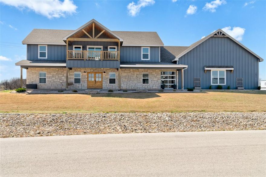 Perched on approximately one acre overlooking the scenic waters of Fort Phantom Lake, this stunning luxury home at 1821 Aces Trail offers nearly 2,930 square feet of thoughtfully designed living space. With 5 bedrooms and 3 bathrooms, the layout blends spaciousness with functionality while maximizing the incredible lake views. The open-concept main floor features a bright living area that flows seamlessly into the kitchen and dining spaces, creating an inviting setting for both everyday living and entertaining. The primary suite and two additional bedrooms are conveniently located on the main level. Upstairs, a second living area overlooks the main living room below, creating a dramatic sense of openness and light. Two additional bedrooms and a full bathroom complete the second floor. Designed with comfort and quality in mind, the home includes a tankless gas water heater, whole-home water filtration and softener system, and a heated garage. A custom breezeway with roll-up door creates the perfect indoor-outdoor transition space—ideal for relaxing while taking in the beautiful lake views. The second-floor balcony offers yet another vantage point to enjoy the peaceful surroundings. With expansive space, thoughtful upgrades, and breathtaking views of Fort Phantom Lake, this property offers a rare opportunity to enjoy luxury living with room to breathe.