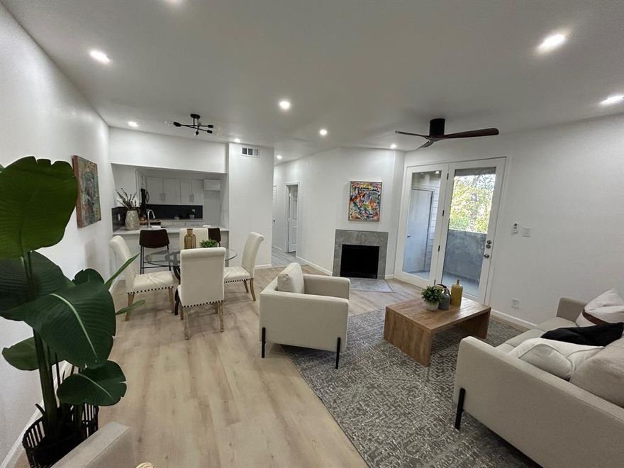 Fully renovated 2 bedroom condo in Dallas with an open, light-filled layout. The living room features tall ceilings, modern flooring, LED lighting, and a wood-burning fireplace. The updated kitchen includes new cabinets, quartz countertops, stainless steel appliances, and a breakfast bar that opens to the dining and living areas.

The bathroom has been remodeled with contemporary tile and a quartz vanity. The primary bedroom offers a large walk-in closet and overlooks the wooded creek. The second bedroom also enjoys creek views and works well as a home office.

A private patio with storage sits off the living room, and a designated parking space is conveniently located near the back entrance.  Comes with stackable washer & dryer!

Great condo for someone looking for their personal home or as an investment!