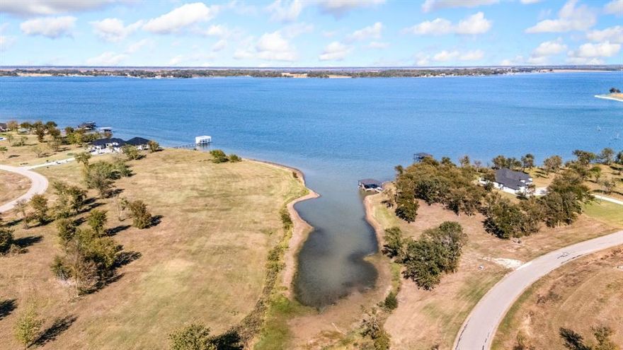 Your Lakefront Escape Awaits! Discover unbeatable value with this oversized 1.8-acre lot offering stunning waterfront views and direct walkability to the marina. Nestled within Diamond Point, an exclusive new gated community on the picturesque peninsula of Richland Chambers Lake—the third largest lake in Texas—this property blends natural beauty with modern convenience. Just over an hour from Dallas and only 20 minutes from Downtown Corsicana, Diamond Point is ideal for weekend getaways or full-time living. Enjoy easy access to local favorites like Collins Street Bakery, HEB Grocery, Starbucks, and Chick-fil-A, plus charming boutiques and restaurants in Corsicana’s adorable downtown Gated entrance with scenic terrain, paved roads and underground utilities. Optional boat slip available.
Whether you're seeking tranquility, recreation, or investment potential, this lot delivers. Come experience the lifestyle Diamond Point has to offer—where lake living meets luxury and convenience.