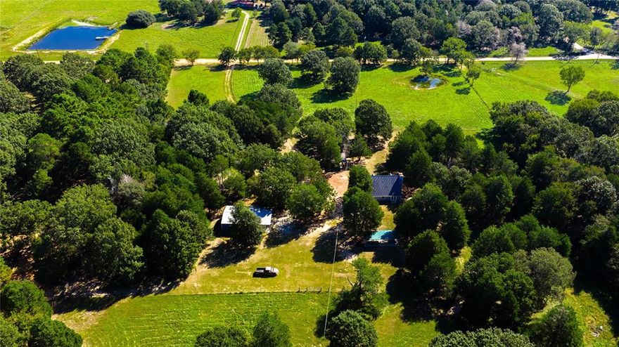 Discover the perfect blend of space, comfort and functionality with this peaceful 10-acre homestead. Nestled in a peaceful setting, this 1,728 square foot home offers three bedrooms and two full bathrooms. This property truly shines with expansive 1,500 square foot workshop - ideal for hobbies, storage, or running your at home business. Enjoy the East TX sunrise and sunsets from either of the 2 charming gazebos, perfect for relaxing, or entertaining company. This property truly offers the best of country living. An additional 6+ acres adjoining the property is also available to be purchased together or separately.