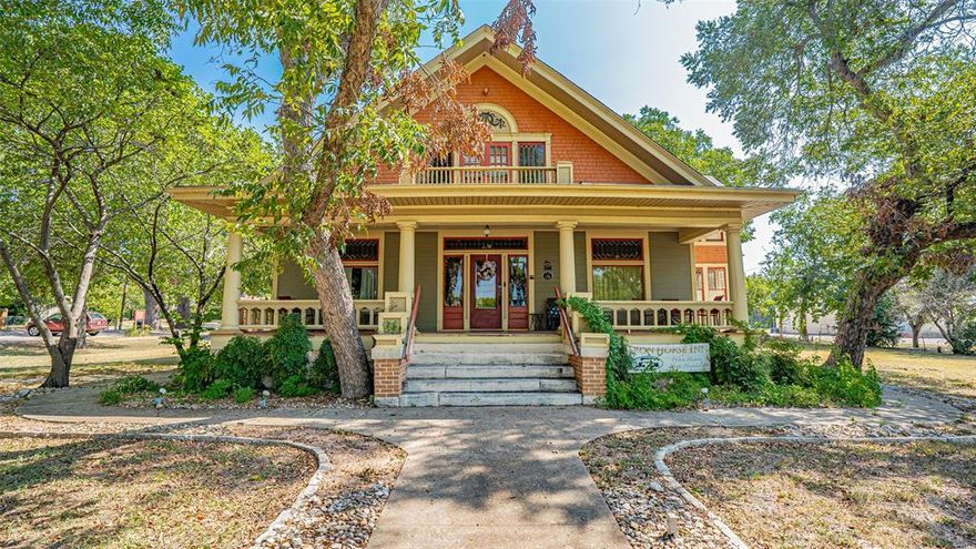 Experience the grandeur of turn-of-the-century Texas with this rare opportunity to own a fully furnished historic property near downtown Granbury. Currently operating as a Bed & Breakfast, but the home also offers the option for a private residence use as well.
This elegant craftsman with Victorian details showcases high ceilings, crown molding, leaded glass windows, Birdseye maple and pine wood flooring, pocket doors, wainscoting, boxed-beam ceilings, built-ins, storage benches, transom windows, fainting porches, custom brick fireplaces and 8 dedicated parking places. Each bedroom functions as a private suite with an updated bath, walk-in shower, and ample closet space. This property has had extensive renovations including, 3 new heat pumps and AC, PEX plumbing and insulation throughout most of property.  
The converted carriage house serves as a stand-alone cottage or storage unit with plumbing and electrical in place, offering potential for additional living space. There is also a separate laundry room building and a 2 story storage or craft room on the property. Back on the market due to buyer not being able to sell their current home.