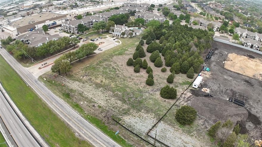 Prime commercial opportunity in East DFW! This 2 acre parcel of unimproved land is ideally positioned with direct frontage on US Highway 80 in Mesquite, offering high visibility and excellent access for your next development project. Zoned for commercial use, this lot is surrounded by dense residential and retail developments, including the adjacent 295-unit Class A luxury apartment community, Advenir at Mission Ranch, with rental rates ranging from $1,300–$2,300. The location benefits from a strong traffic count and close access to major highways including I-635, I-30, and I-20, providing seamless connectivity to Downtown Dallas, Garland, Richardson, and Plano. With city water, city sewer, curbs, and electricity already available, the infrastructure is in place to support your build. Located in Mesquite ISD and minutes from established neighborhoods, shopping, and services, this lot is perfect for retail, office, or service-driven development. The land features grassed and wooded vegetation, few trees, and no subdivision restrictions—offering flexibility to suit your vision. Call the listing agent today for more details and to explore this prime investment opportunity!