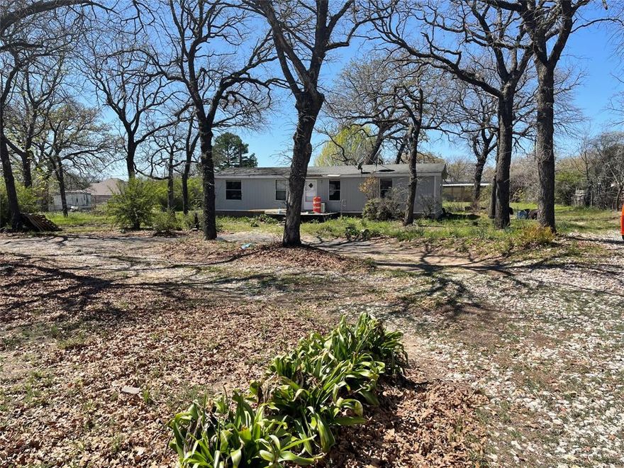 This beautiful 1 acre lot is heavily wooded and includes a well and community water.  With a little TLC you would have your own little slice of paradise.