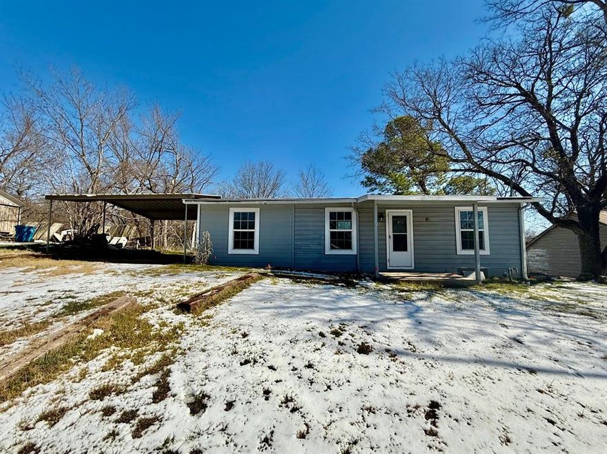 HUD owned property.  Case #513-274053.  HUD properties are sold As-Is.  Broker must be registered with HUD to sell property.  No repairs or alterations until after closing and funding.  This inviting single story home sits on a spacious cleared lot with a fenced backyard and a convenient two car carport. Inside, the open kitchen flows into the living area, featuring granite countertops and washer and dryer hookups for everyday ease. Modern laminate wood flooring adds a stylish touch throughout the bedrooms and living room, creating a warm, updated feel perfect for comfortable living and entertaining.