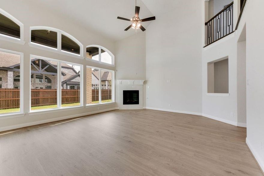 Experience luxury, comfort, and convenience in this stunning new Grand Home, scheduled for completion in November. Perfectly situated within the highly rated Mansfield ISD, this residence offers an ideal setting where all schools are just a short walk or bike ride away. Nestled between Dallas & Fort Worth, the home provides effortless access to premier shopping, dining, & entertainment options.
This Energy Star Certified property welcomes you with impressive curb appeal, an elegant eight-foot front door, and extensive hardwood flooring throughout. Inside, the open-concept layout showcases a vaulted family room with a cozy gas fireplace that flows seamlessly into a spacious covered back patio—perfect for relaxing or entertaining. The gourmet kitchen serves as the heart of the home, featuring Shaker-style cabinetry, Omegastone countertops, a five-burner gas cooktop with custom wood vent hood, stainless steel appliances, pots and pans drawers, and a generous island for casual dining or meal prep.
Designed for modern living, the home includes five bedrooms, with a convenient downstairs guest suite ideal for multigenerational families. The full oak staircase with wrought iron spindles leads to a large game room and an additional media or bonus space. The luxurious primary suite offers a serene retreat with a garden tub, dual Marlana vanities with framed mirrors, rectangular sinks, and a glass-enclosed tiled shower.
Additional highlights include eight-foot interior doors, rocker light switches, R-38 insulation, and a radiant barrier for exceptional energy efficiency. Combining style, functionality, and location, this home delivers the perfect blend of sophistication and everyday comfort in one of the area’s most desirable school districts.