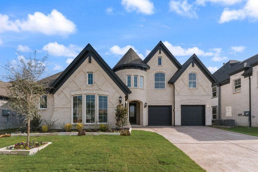 Experience luxury, comfort, and convenience in this stunning new Grand Home, scheduled for completion in November. Perfectly situated within the highly rated Mansfield ISD, this residence offers an ideal setting where all schools are just a short walk or bike ride away. Nestled between Dallas & Fort Worth, the home provides effortless access to premier shopping, dining, & entertainment options.
This Energy Star Certified property welcomes you with impressive curb appeal, an elegant eight-foot front door, and extensive hardwood flooring throughout. Inside, the open-concept layout showcases a vaulted family room with a cozy gas fireplace that flows seamlessly into a spacious covered back patio—perfect for relaxing or entertaining. The gourmet kitchen serves as the heart of the home, featuring Shaker-style cabinetry, Omegastone countertops, a five-burner gas cooktop with custom wood vent hood, stainless steel appliances, pots and pans drawers, and a generous island for casual dining or meal prep.
Designed for modern living, the home includes five bedrooms, with a convenient downstairs guest suite ideal for multigenerational families. The full oak staircase with wrought iron spindles leads to a large game room and an additional media or bonus space. The luxurious primary suite offers a serene retreat with a garden tub, dual Marlana vanities with framed mirrors, rectangular sinks, and a glass-enclosed tiled shower.
Additional highlights include eight-foot interior doors, rocker light switches, R-38 insulation, and a radiant barrier for exceptional energy efficiency. Combining style, functionality, and location, this home delivers the perfect blend of sophistication and everyday comfort in one of the area’s most desirable school districts.