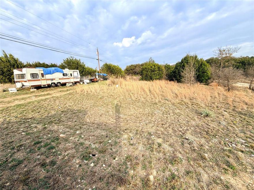 Corner Lot  in Shamrock Shores area less than 2 miles from Lake Brownwood. 15 minute drive to State Park. This lot would be great to set up your RV or mobile home.  Electricity and meter are already in place.  Brookesmith water is in the process of running water lines to the neighborhood and new owner would be able to get a water tap from Brookesmith water to have water on the property.  Seller will Finance balance with $6k down.