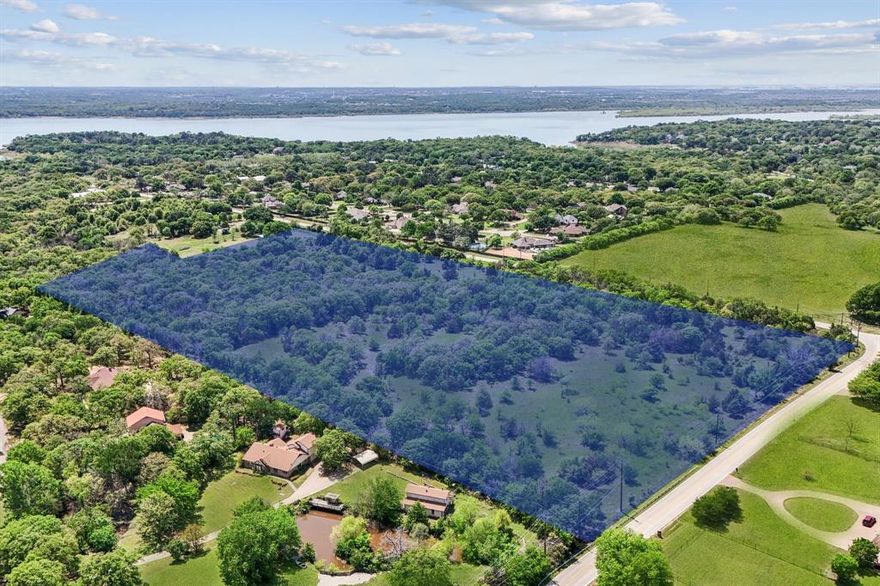 Endless Potential Awaits on 23 Pristine Acres in Flower Mound! This exceptional 23-acre property offers a rare opportunity for visionary developers or those seeking to create a one-of-a-kind private estate. Nestled in the highly sought-after LISD Flower Mound school zone—just minutes from Liberty Christian—this land is primed for a future of luxury and lifestyle. Whether you envision a thoughtfully planned residential community or a secluded, nature-filled retreat, the possibilities are endless. The land is graced with mature native trees, wildflowers, and a natural creek, creating a serene, park-like setting that's truly unmatched. Imagine crafting a subdivision where every homesite is surrounded by lush greenery, native wildlife, and scenic views—or keeping it all for yourself as a private haven designed to reflect your unique vision. Located just a short walk from a private beach and equestrian trail, outdoor adventures are right at your doorstep. Plus, with excellent access to Wichita Trail and Shiloh Road, commuting and connectivity are effortless. Whether you're a builder, investor, or someone looking for their own slice of paradise—this is your blank canvas. Come explore the possibilities and let your imagination take root.