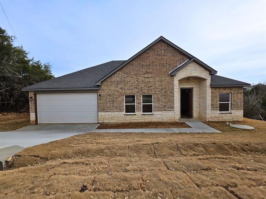 Welcome to 2507 Lakeridge Dr in Granbury, Texas, a stunning brand-new 4-bedroom, 2-bath home that perfectly blends modern design with everyday comfort. This new construction offers peace of mind with a full builder’s warranty and thoughtful finishes throughout.
Step inside to a bright, open-concept layout ideal for both entertaining and daily living. The spacious kitchen flows seamlessly into the dining and living areas, creating a welcoming space for gatherings of any size. The private owner’s suite serves as a relaxing retreat, featuring a well-designed bathroom and generous closet space, while the additional bedrooms provide flexibility for guests, a home office, or growing households. Just minutes from your front door, you’ll find the best of Granbury living  from scenic Lake Granbury with boating, fishing, and lakeside picnics to the historic Granbury Square filled with boutique shops, local eateries, wine bars, and seasonal events. Whether you’re exploring scenic trails, catching a movie at the iconic Brazos Drive-In, or enjoying live music and theater downtown, this location strikes the perfect balance between daily convenience and weekend adventure.