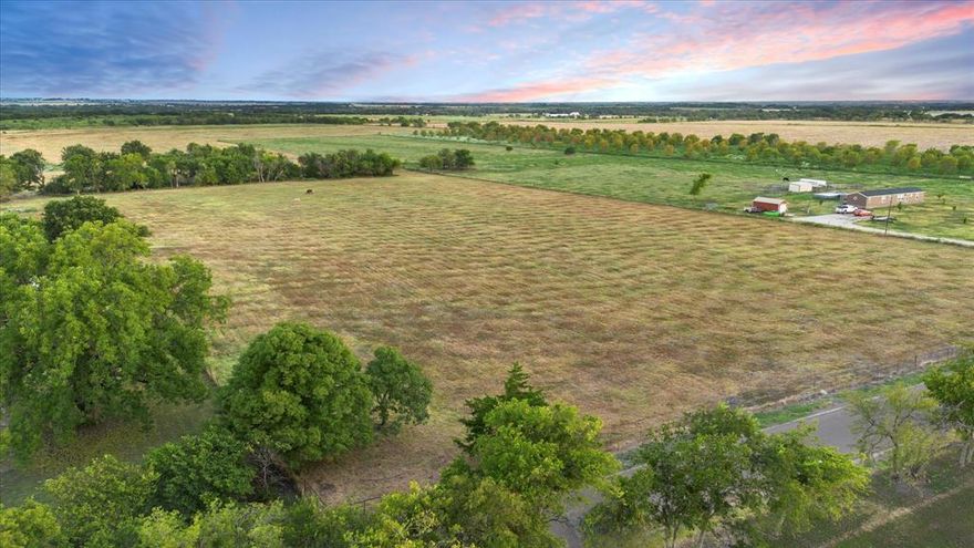 Experience country living at its finest with this expansive and picturesque land offering in the southern part of Waxahachie. Nestled outside city limits, this nearly fully fenced property features a charming stock tank and lush, scenic tree lines that enhance its natural beauty. Enjoy the benefits of an agricultural exemption, which the property currently maintains, and approximately 400 feet of serene road frontage. Utilities, including water and electric, are conveniently accessible at the street. With the option for owner financing, this property offers flexible terms for your rural retreat. Perfect for those seeking privacy and captivating views in a serene and welcoming setting. If you are looking to add to your long-term real estate investment portfolio, acquiring land in this part of town seems like a perfect fit! For those investors looking for a quicker return, you may find developing this property intriguing. If you are searching for that new country getaway to call home, this one checks that box as well! While you will fall in love with the feeling of peace and tranquility of the area, you are also conveniently less than 20 minutes from quaint downtown Waxahachie and all it has to offer. Come visit today!