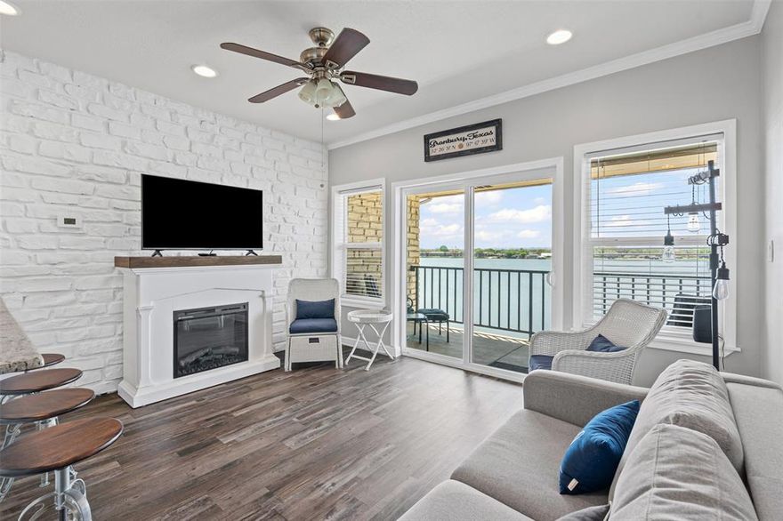 Low maintenance, main body waterfront Condo less than a quarter mile from the Granbury Square. This 1 bedroom, 1 bath condo has a spectacular view of Lake Granbury, with a front row seat to all of the festivities that come to downtown. Shopping, restaurants, festivals, playgrounds, beachfront, fishing piers, boat docks and ramps, all within a 0.25 miles of front door. The spacious great room showcases a feature wall of white stone, low maintenance vinyl flooring, granite counter tops, stainless steel appliances, recessed and track lighting, large sliding glass doors that allow for light as well a beautiful view of the lake. The condo includes access to the renovated boat dock and fishing pier, pool, fitness center, club room, on-site laundry, and assigned covered parking.