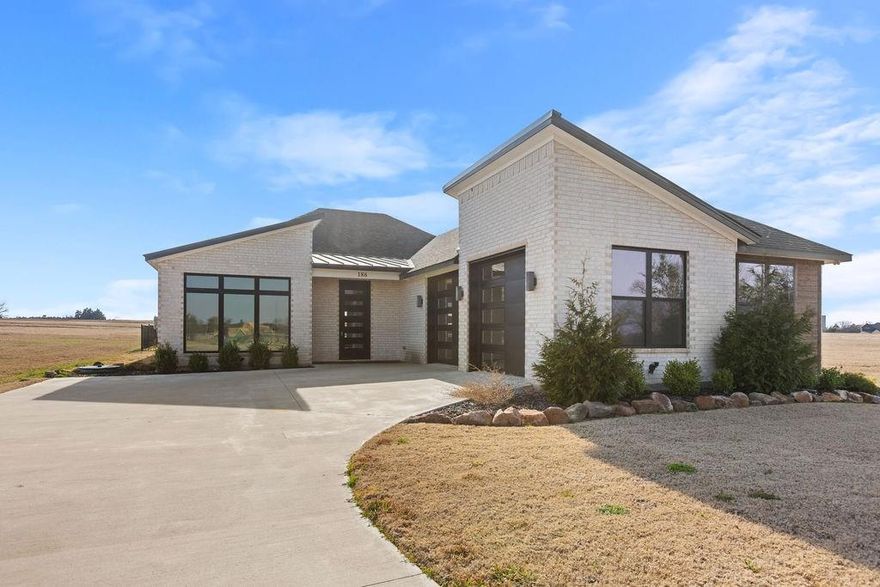 Luxury living in prestigious Rock Creek Resort! Live the good life in this stunning home nestled within the highly sought-after Rock Creek Resort, a top-ranked golf community featuring a championship course designed by the renowned Jack Nicklaus Design Group. Residents enjoy exclusive amenities, including a gated entrance, private boat ramp, marina, community pool, clubhouse with a restaurant, pro shop, activity trails, and more! Designed for modern living, this energy-efficient, foam-insulated home offers an inviting open-concept layout, perfect for entertaining. The chefs kitchen is a showstopper, featuring high-end Cafe appliances, a propane gas double oven range, a built-in drawer microwave, quartz countertops, a spacious island, abundant cabinetry, and a pantry. The luxurious primary suite is conveniently located off the living room and offers a spa-like retreat with dual sinks, a soaking tub, a separate shower, and an oversized closet that is connected to the laundry room. Secondary bedrooms and a full bath are separate from the primary suite. Need extra space? A versatile bonus room can serve as a home office, formal dining, or second living area. Outside, the covered back patio, complete with a built-in grill, sink, and mini fridge, are ideal for outdoor gatherings. This exceptional home is a must see! Make your appointment today!