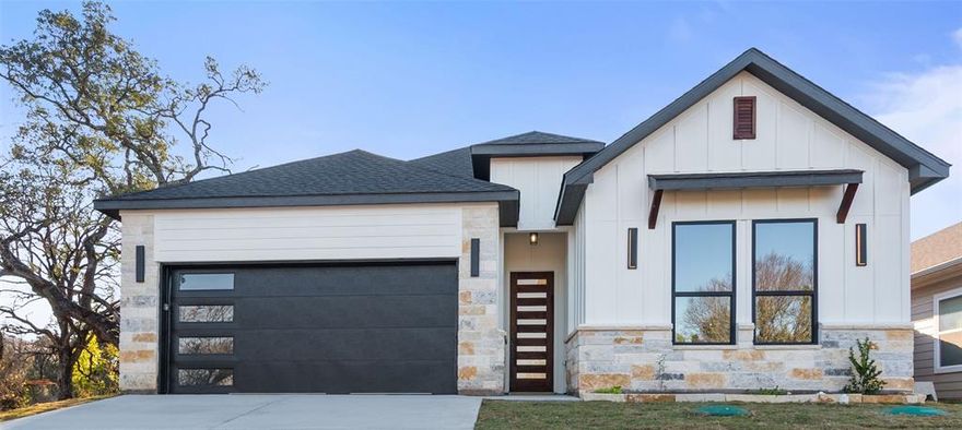 Experience modern comfort and timeless style in this custom-built new home featuring 3 bedrooms and 2 bathrooms. Venture inside to an inviting open-concept layout enhanced by high ceilings and a warm, neutral palette. The impeccable kitchen is the heart of the home, showcasing shaker-style cabinetry, sleek quartz countertops, a large island ideal for gathering, and a spacious walk-in pantry for all your storage needs. The bright living room offers a cozy electric fireplace, perfect for relaxing evenings. A separate utility room—with its own wash basin—adds everyday convenience. Retreat to the primary bedroom, complete with a generous walk-in closet and a beautifully appointed ensuite. At the front of the home, two spacious, light-filled bedrooms offer generous closet space and enjoy access to an elegantly finished bathroom set gracefully between them. The 2-car garage provides secure parking plus plenty of room for storage, a home gym, or a workshop. Located just minutes from shopping, dining, and all the charm of downtown Granbury, this exceptional home offers the ideal blend of comfort and convenience. Don’t miss your chance—schedule a private tour today!