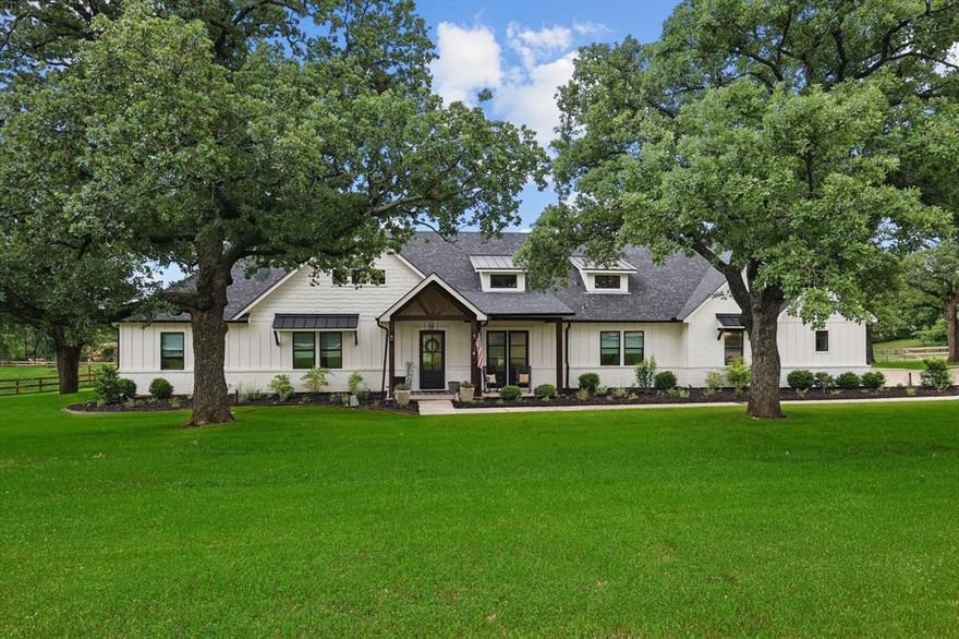 Modern Farmhouse Masterpiece on 4.64 Acres in Bartonville – Zoned to Argyle ISD & Walking Distance to Liberty Christian
Low Taxes – High Style – Unmatched Privacy. An extraordinary modern farmhouse estate in the heart of Bartonville, zoned to the award-winning Argyle ISD & just a short walk to Liberty Christian School. Perfectly positioned on a private cul-de-sac, this one-of-a-kind 4.64-acre estate offers the ideal blend of luxury, functionality & rare financial benefits. Unbeatable Taxes: You simply won’t find another property like this. With 1 acre homesteaded & 3.64 acres carrying an ag exemption for hay and livestock, the 2024 property taxes were $5,958.36!!! Plus a tax rate of just $1.71 per $100 of assessed value—one of the lowest zoned to Argyle ISD. Brought down to the foundation & brilliantly reimagined by architect Jamie Linn, this home has been completely transformed & expanded to a sprawling 5,196 sq ft.  Main Home Highlights: 4 spacious bedrooms + 3 full bathrooms, one half bath and study on the main floor. Open-concept kitchen & living with stunning views of the rolling acreage,  private primary suite with a custom closet worthy of a boutique. Finished flex room upstairs with half bath. Gorgeous front porch made for Texas evenings. Private backyard retreat with pool (installed in 2022), covered cabana, & peaceful pond for your livestock or fishing fun. Charming 2-bed 1-bath guest house with full kitchen, living room, utility room, & 2-car tandem garage. Barn for storage, pasture for livestock or hay, & beautiful mix of trees and open land. Newly installed electronic gate ensures ultimate privacy and security.  Whether you’re raising a family, entertaining guests, or looking for a serene place to call home, this property checks every box—and then some. With low taxes, prime location, & high-end custom finishes throughout, there’s simply nothing else like it on the market.