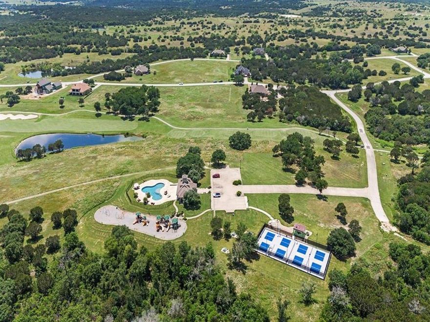 The perfect canvas for your dream home awaits at 6628 Muirfield Drive! Tucked inside the rolling hills of The Retreat, this lot offers more than just land—it’s an invitation to experience the resort lifestyle. Imagine waking up to peaceful views, spending afternoons on the championship golf course, and ending your evenings with friends at the clubhouse restaurant or a quiet walk along the trails. This 3,000-acre gated paradise is more than a neighborhood—it’s a community. With two sparkling pools, tennis and pickleball courts, hiking trails, fitness center, playgrounds, fishing ponds, and 24-hour security, there’s something here for everyone. Best of all, there’s no timeline to build, giving you the freedom to plan at your own pace with an approved builder of your choice. For those visiting the community while building, The Retreat also offers beautifully furnished one-bedroom villas and spacious two-bedroom condos. Villas are located near the clubhouse and pool and feature kitchenettes, patios or balconies, and space for up to four guests. The condos include full kitchens, open floor plans, and private porches or balconies—making it easy to enjoy the community firsthand while planning your dream home. Whether you’re looking for a weekend escape, a retirement haven, or your forever home, this lot offers a rare chance to join one of the most sought-after country club communities in DFW. Come and see for yourself why The Retreat isn’t just where people live—it’s where they thrive.