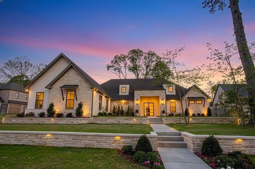 Luxury new construction residence in the prestigious gated community of Sentinel Park at Legacy Bend. This refined expression of traditional luxury offers 5 bedrooms plus a dedicated office, 3.5 bathrooms, with 4,155 square feet of thoughtfully designed living space. A cohesive interior unfolds through custom built-ins, layered lighting, wood flooring, continuous surround sound, and expansive slide and stack doors. The kitchen showcases its beautiful slim shaker 2 tone cabinets, custom vent hood and Taj Mahal Quartzite surfaces that extend from the countertops into a full-height backsplash. The Butlers pantry has a drawer microwave, dedicated freezer space, and abundant storage. The separate dining area is elevated by a built in bar complete with a beverage fridge and ice maker. The primary suite offers a private retreat with elevated finishes, including a makeup vanity mirror, hidden drawer storage, bidet toilet, multi-head shower, soaking tub, and thoughtfully incorporated built-ins. Additional features such as a pull-down third rack system and a retractable central vacuum with vac pan further enhance everyday convenience. Secondary spaces maintain the same level of detail, with custom closet systems, a porcelain slab vanity in the hall bath, and a powder bath with outdoor access and LED mirror. Slide-and-stack doors open to a backyard paradise anchored by a gunite pool. The covered patio features an outdoor kitchen that is fully equipped with a 32' Blaze gas grill, Vevor beverage cooler, and a 2nd fireplace.