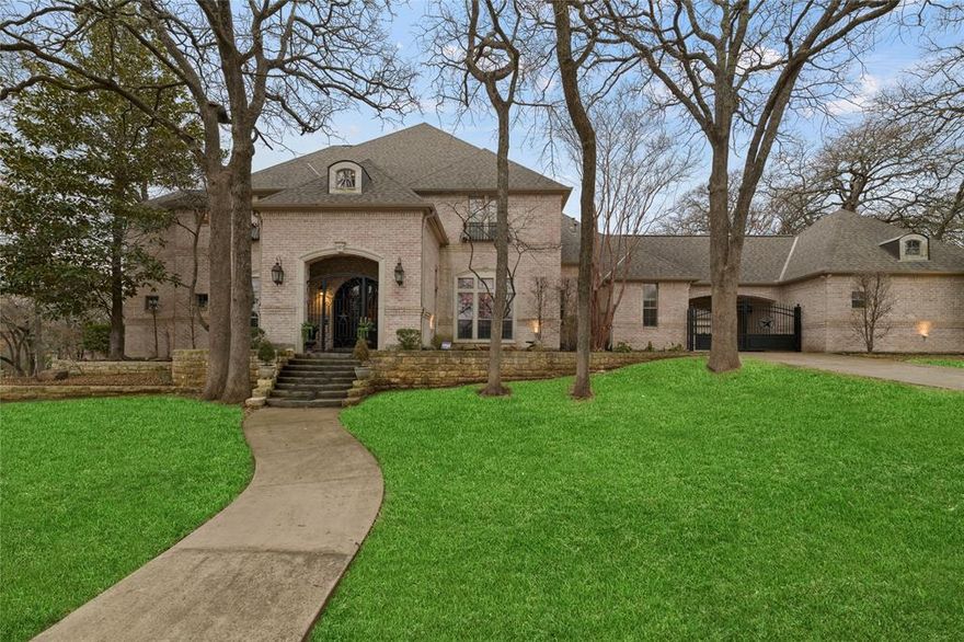 This beautiful Southlake home lies on 1-acre of lush, private, heavily treed land. Stunning Claffey salt water pool, spa, waterfall and grotto. Curb appeal to die for and the outdoor living, kitchen, and fire pit make your home the popular spot for parties. The spacious 5-bedroom home includes a convenient first floor mother-in-law suite with kitchenette. The luxurious primary suite is located across the house for privacy. Flexible layout allows for various bedroom combos or a large gym plus an impressive second floor game room. The home is equipped with two cutting-edge geothermal heating and cooling units providing comfort and energy efficiency year round. It's NOT in the DFW flight path and the peacefulness of this home has kept these owners here for 15 years. The porte cochere plus 4 car oversized garage will fit that Texas truck of yours. Roof replaced in 2017 with radiant barrier. Seller will leave 90% of furniture! Greenhouse stays! Highly motivated- Bring offers