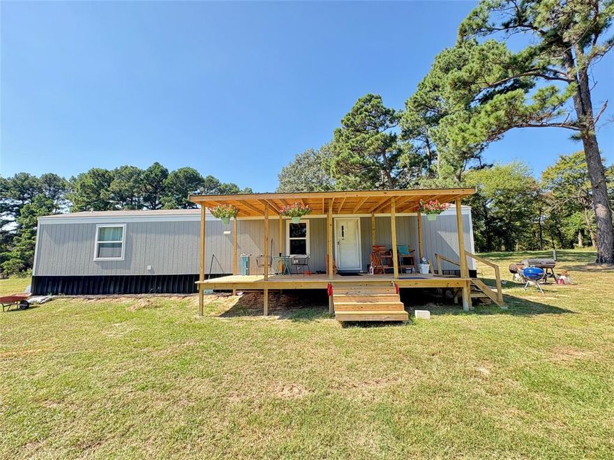 Welcome to your slice of country living! This 2025 Clayton Homes 2-bedroom, 2-bath single-wide sits on approximately 6 beautiful acres, offering the perfect blend of open pasture and mature shade trees. Recently installed and move-in ready, the home features a modern interior with the peace of mind that comes from updated systems throughout. There’s even enough space and road frontage to add another home if desired!
A recently completed water well and aerobic septic system are already in place, so the essentials are covered. The land offers plenty of room for a hobby farm, gardening, or outdoor recreation, while the no known restrictions status means you can bring your horses, livestock, or other farm animals with ease.
Here, you’ll enjoy the serenity of the countryside while still being just minutes from town, schools, shopping, and everyday conveniences. Whether you’re searching for a weekend retreat, a comfortable starter property, or the foundation for your forever homestead, this acreage offers endless possibilities.
There's even enough room to build a dream home near, on same property then use the single wide as a mother in law home or for that adult child.