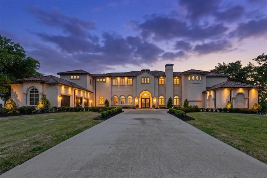 Imagine a life where every sunset belongs to you. Perched above the shimmering waters of Lake Texoma, this home is a masterwork of luxury and legacy. Built as the personal sanctuary of legendary builder & designer Michael Munir, this nearly 8,000-sqft estate represents the pinnacle of his 50-year career. Set on 1.78 lakefront acres, it is a masterpiece crafted for those who believe living well is an art form. Morning begins on your 60-ft covered balcony as the lake breeze stirs. The day flows effortlessly from the chef’s kitchen - a true culinary arena featuring a 60” Wolf range, dual Sub-Zero refrigerators, and Miele dishwashers - to the sprawling 60-ft veranda. Whether you’re hosting a summer gala or an intimate family brunch, this home is a vessel for hospitality, designed to comfortably accommodate 18 guests, including a bespoke bunk room that becomes a kingdom for children. As evening nears, the sunken bar becomes the social heart of the home. Pour a vintage from the 150-bottle wine fridge and watch the sky turn gold through the walls of Jeld-Wen glass. For the ultimate escape, retreat to the private cinema. This isn’t just a media room; it’s a $250,000 sensory experience with California Audio Tech speakers, custom upholstered walls, and leather seating for 15. While the lifestyle offers one of pure relaxation, the engineering is one of pure peace of mind. You are protected by an 18-ft motorized privacy gate, a whole-home fire suppression system, and a 2026 security suite. The residence is a fortress of comfort, featuring five Lennox heat pumps, dual Navien tankless heaters, and a foundation anchored by 60 commercial-grade piers. Outside, a professional grilling station with its 42” Lynx Allsear grill beckons for weekend cookouts. Above the three-car garage, a finished, air-conditioned space offers a quiet retreat for a studio or gym. You aren't just buying a home - you are inheriting a master builder’s magnum opus, designed for a life lived without compromise.