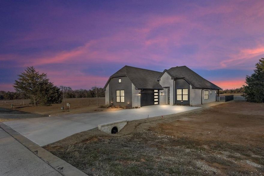 Come live in prestigious Rock Creek Resort! This top ranked golf community has a course designed by The Jack Nicklaus Design Group. Additional amenities available to community members are a gated community, private boat ramp, marina, community pool, clubhouse with restaurant, pro golf shop, & much more! This well designed, single story, energy efficient, foam insulated home, has an open concept floorplan making this home perfect for entertaining! The kitchen offers a propane gas range, built-in drawer microwave, quartz countertops, large island with storage underneath, loads of cabinets & a pantry! Primary retreat is just off the living room & bathroom has double sinks, soaking tub, separate shower, & a large closet. Secondary bedrooms & bath are separate from primary. LVP flooring in all rooms & designer ceramic tile in baths & laundry. Extended covered back patio offers a built-in grill, sink, & mini fridge! This home is on the lake side of Rock Creek! This truly is a MUST SEE today!