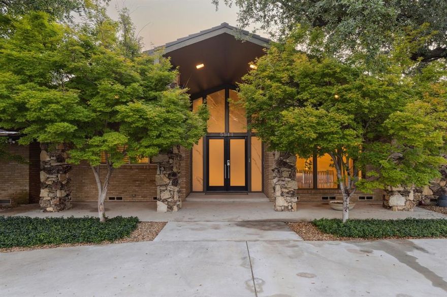 Nestled in a private cul-de-sac in the heart of Dallas' Russwood Acres and private school corridor, this one-of-a-kind 6,400 sq ft mid-century modern masterpiece offers an extraordinary blend of timeless design and luxurious amenities on a full acre lot. Designed for both entertaining and everyday comfort, the home features 5 spacious bedrooms and 7 total baths, with meticulous attention to detail throughout. The sleek mid-century architecture is complemented by museum-finished walls, perfect for showcasing your art collection, and an abundance of natural light that pours in. Terrazzo floors flow seamlessly through the main living spaces, leading to a gourmet kitchen outfitted with premium Thermador appliances. A second living area with a bar and beer-wine tap, and a media room-third living area offer stylish spaces for both quiet relaxation and vibrant gatherings.
The primary suite is a true retreat, boasting dual spa-inspired baths—one with a built-in sauna, and the other featuring aromatherapy, steam, LED light therapy, a 6-ft soaking tub, heated floors, waterproof Bluetooth speakers, and a rain shower. A bonus room off the master serves as a private weight room, offering unmatched convenience. A 422 sq ft solarium is located off of the primary suite as well. Step outside to your personal oasis, where a saltwater diving pool is surrounded by lush turf, beautifully landscaped grass, and an enclosed patio perfect for year-round enjoyment. The fully fenced acre lot also includes two remote control gates, a fenced in animal enclosure with mature grapevines, a 3-car garage with extended concrete parking, and unmatched privacy. Located less than 20 miles from DFW Airport and under 15 miles from Love Field, this rare estate is a striking example of design, comfort, and convenience. Homes like this simply don’t come around often—experience the details within the details. Ask for a full list of all the upgrades!