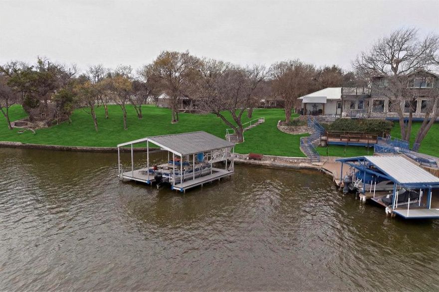This remarkable lakefront retreat in Granbury, Texas, presents an exceptional opportunity that harmoniously combines luxury, comfort, and investment potential. Boasting four spacious bedrooms and three well-appointed bathrooms, the home is meticulously designed to include an expansive living area for entertaining or relaxation. The kitchen is perfectly suited for entertaining, as well as everyday living, making it a central hub for family and friends. The thoughtful layout fosters a welcoming atmosphere, ideal for hosting gatherings while preserving a serene, private retreat ambiance. Whether you are entertaining loved ones or enjoying a peaceful weekend getaway, this home truly embodies the essence of a waterfront lifestyle.

The outdoor living space is equally impressive, enjoy breathtaking views of the lake while seamlessly merging indoor comfort with the natural beauty of the outdoors. Features include a sizable dock with a boat slip and ample room for fishing and other activities, designed for year-round enjoyment. The property sits on an oversized lot strategically positioned to capture stunning lake vistas, providing an abundance of space for enjoying the joys of lakefront living.

Situated in one of the most desirable lakefront communities near the DFW area, Granbury is thriving with strong tourism, family getaways, and weekend visitors. Just minutes from the historic downtown Granbury, residents and guests benefit from convenient access to dining, shopping, entertainment, and community events.

In addition to its lifestyle appeal, this property possesses significant Airbnb potential. Whether you envision this as a primary residence, vacation home, or investment property, this retreat offers a sanctuary of tranquility and peaceful surroundings.
This is a rare opportunity to acquire a lakefront property that delivers lifestyle value, income potential, and proximity to the vibrant DFW area all within one of the most sought-after waterfront communities.