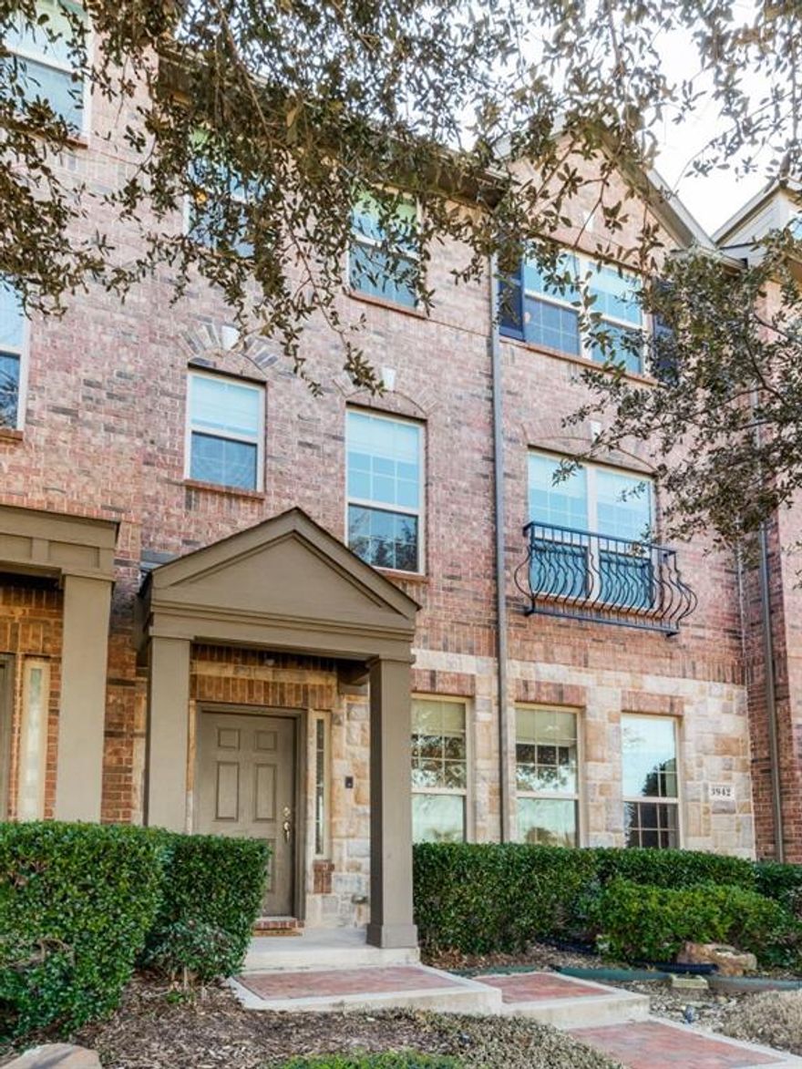 Upgraded contemporary townhome with lots of custom built-ins! You'll love the built-in wine rack, bookcases and storage available. Easy-care wood-laminate flooring throughout living areas; ceramic tile in baths. Dual sinks in primary bath and one guest bath. All three bedrooms have full bath. Island in kitchen, gas range, built-in microwave, balcony off primary bedroom. First floor has flex space for exercise or office with half bath and elegant sliding barn door. 2-car garage. Popular Addison area. All Addison amenities available to occupants. $10 one-time fee to Addison Athletic Club as long as occupant lives in Addison. Sand volleyball court behind these units. 2022-2023 UPDATES: new interior paint including doors and trim, wood and tile flooring installed, barn door in 1st level flex room, granite added to half bath and guest baths, new toilets in all baths, new tub in guest bath, faucets upgraded, cabinets resealed, recessed lighting added, garage painted, both ACs serviced.  2025 UPDATES: Kitchen cabinets repainted white.  Occupant TO SUPPLY REFRIGERATOR, WASHER & DRYER.  LL PAYS HOA FEES.  Occupant MUST SHOW PROOF OF RENTAL INSURANCE BEFORE MOVE-IN.  APPLICATION FEE: $50 Per Adult