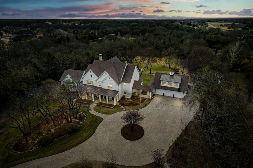Unmatched privacy and park-like views abound in this modern farmhouse estate encircled by trees on a 2-acre creekside lot, no HOA. Light-filled, expansive open floor plan and numerous covered patios offer endless entertainment options, enhanced by chef’s kitchen, dbl fridge and dishwashers, surround sound, wine bar with barn door and stand-alone ice maker. Multi-purpose room with extra counter space, cabinets, sink and fridge perfect for staging gatherings. Tranquil master and library or office suite with fireplace and marble bath connected by glass breezeway. Second story entertainment room with tree-house deck perfect for dining under the stars. Circular paver drive and 3 car garage with full apartment above.