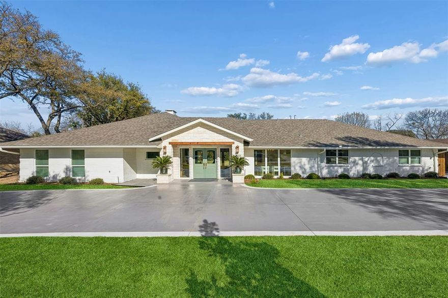 Nestled in the exclusive enclave of Russwood Acres, this stunning 5-bedroom home has been completely taken to the studs and reimagined with impeccable craftsmanship and high-end designer finishes throughout. Spanning 4,292 square feet on a beautifully manicured .51-acre lot, the home offers 5 spacious bedrooms, 4 full bathrooms, and 2 powder baths — thoughtfully designed for both refined entertaining and comfortable daily living. The heart of the home is a fully renovated chef’s kitchen featuring gorgeous, Calacatta Gold marble countertops, designer lighting and hardware, abundant prep space, bar seating, and a charming breakfast room just off the kitchen. Entertain effortlessly in the formal dining room with dedicated space for a china cabinet, or gather around the gorgeous stained oak wet bar complete with a wine refrigerator. Expansive windows in both the living room and den frame serene views of the lush backyard, creating a seamless indoor-outdoor connection. Step outside to your private retreat featuring an outdoor kitchen equipped with a gas grill and a Large Green Egg charcoal grill — ideal for year-round entertaining. Car enthusiasts and hobbyists will appreciate the newly constructed three car garage with soaring 12-foot ceilings, offering both function and flexibility. With every detail carefully curated this exceptional home blends timeless elegance with modern luxury in one of Dallas’ most coveted neighborhoods.