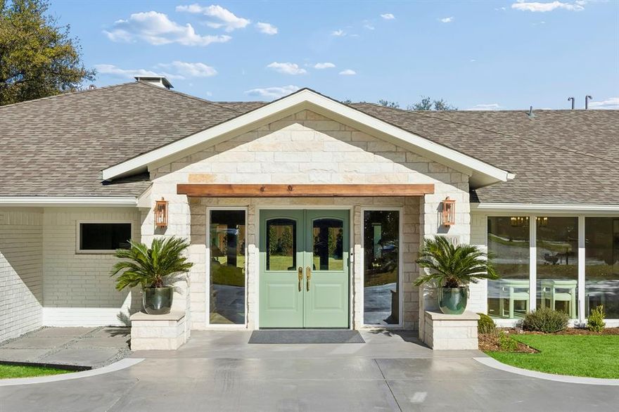 Nestled in the exclusive enclave of Russwood Acres, this stunning 5-bedroom home has been completely taken to the studs and reimagined with impeccable craftsmanship and high-end designer finishes throughout. Spanning 4,292 square feet on a beautifully manicured .51-acre lot, the home offers 5 spacious bedrooms, 4 full bathrooms, and 2 powder baths — thoughtfully designed for both refined entertaining and comfortable daily living. The heart of the home is a fully renovated chef’s kitchen featuring gorgeous, Calacatta Gold marble countertops, designer lighting and hardware, abundant prep space, bar seating, and a charming breakfast room just off the kitchen. Entertain effortlessly in the formal dining room with dedicated space for a china cabinet, or gather around the gorgeous stained oak wet bar complete with a wine refrigerator. Expansive windows in both the living room and den frame serene views of the lush backyard, creating a seamless indoor-outdoor connection. Step outside to your private retreat featuring an outdoor kitchen equipped with a gas grill and a Large Green Egg charcoal grill — ideal for year-round entertaining. Car enthusiasts and hobbyists will appreciate the newly constructed three car garage with soaring 12-foot ceilings, offering both function and flexibility. With every detail carefully curated this exceptional home blends timeless elegance with modern luxury in one of Dallas’ most coveted neighborhoods.