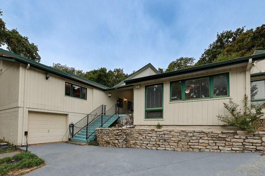 Vacant and ready for immediate move-in, this 3,807 sq ft North Arlington retreat features a private backyard oasis with a swimming pool and separate hot tub, all backed by the peace of mind of a whole-house Generac generator with dual 80-gallon propane tanks. Situated on a quiet cul-de-sac, this 6-bedroom, 4-bathroom home boasts exceptional curb appeal with an updated, leveled, and painted gray driveway leading to a classic front porch and swing. The interior is highlighted by high-end Pella casement windows and a matching sliding glass door that opens to the pool area. A thoughtful floor plan offers a dedicated kitchen and breakfast room that flows into the formal dining room and around to a spacious living room anchored by a stone wood-burning fireplace and built-in bookcases. A unique spiral staircase leads to a private loft, while a large, separate utility room provides built-in cabinets and a folding table. In addition to the primary suite—featuring a skylight and jetted tub—there are five additional bedrooms perfect for the family, guests, or home offices. This prime location is minutes from River Legacy Parks, Crystal Canyon Natural Area, and top-tier golf at Shady Valley Country Club and Lake Arlington Golf Course. With easy access to shopping at Lincoln Square and nearby schools, this home offers the perfect balance of convenience and seclusion. Easy to show—call CSS for instant access!