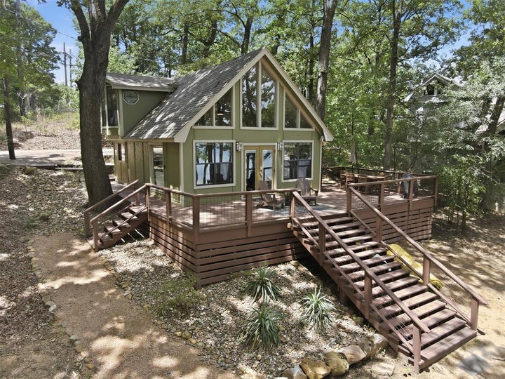 Photo 1 of 31 — 104 E Barker Creek Drive, Scroggins, TX 75480