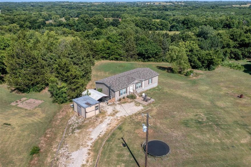 You can have the best of both worlds, a quiet country living outside of city limits but just minutes away from Sherman and the new Texas Instruments. This 3 bedroom, 2 bath home was built in 2018 and sits on a quiet, tree lined 1.98 acres. The home features an open floor plan, island kitchen, ensuite primary, and plenty of storage space. A 12x20 storage building with electricity and insulated sets directly behind the house. Bring your chickens and get your garden started on this little slice of homesteader's paradise. With room to park an RV or lake toys, you won't want to miss this one. Call your favorite Realtor to see it today!