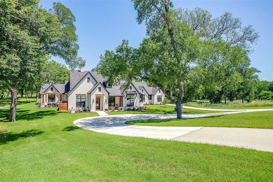 Sprawling ONE STORY showplace with an exceptional layout including a GUEST APT or private office above the garage all on 4 parklike acres under old growth trees with your own access to Bear Creek.  8 outdoor seating areas including a back porch with fireplace, concrete pad with fire pit gathering area, a side porch with pergola for lounging, 2 concrete stairwells leading to sitting areas by the creek and many options for livability by the heated pool & spa.  Unique property offing many ensuite bedrooms, flexible use for many spaces, well designed to maximize natural light and views.  This property offers a homey feel while easily accommodating large gatherings or families.  You will love the kitchen with its bonus dishwasher, 6 burner monogram stainless range & the custom panel front monogram refrigerator + freezer, pull out drawers in kitchen & pantry.  The walk in pantry is amazing!  Other stand out features include: whole home generator, 2 hidden storage areas, dog run accessible from interior pet area, extra dryer space in laundry, driving bridge to the side yard, whole home water filtration system, jelly fish exterior lighting...so much attention to trim throughout.  Energy efficient with spray foam insulation, propane gas (buried tank), multiple gas tankless water heaters, 3 HVACs, well water...  Many expensive items remain or are negotiable including: security cameras, frame TV, gym equipment, Sonos sound system, whole home light control, catch a kid pool net, outdoor furniture & a tornado shelter.  This is a property that makes you want to come home.  Privately located off Bear Creek in a gated neighborhood with close proximity to FW and nearby Kelly Ranch including Tiger Wood's Bluejack.  Welcome home!!