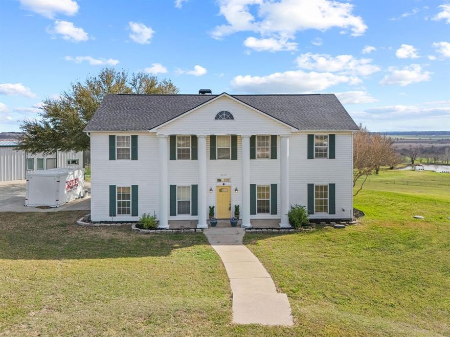 This is a rare opportunity to own 11.5 ACRES of beautiful land in Forney, offering breathtaking views and a serene, peaceful setting. The main house is equipped with a new roof, a new HVAC system, and a newer water heater, ensuring comfort and peace of mind. Step outside to the private deck off the primary suite, where you can unwind and take in the picturesque views of the property and the surrounding area. Mature trees create natural privacy, enhancing the tranquility of your home. The 2024 barndominium is a true gem, featuring a private in-law suite with a living room, bedroom, spacious full bathroom, and kitchenette. With spray foam insulation, an attached roll-up door, two-car covered parking, and an epoxy-coated floor, this space combines comfort and practicality. Outdoor living is just as inviting, with a stocked pond and gazebo perfect for relaxing or entertaining. The property  includes a chicken coop, making it ideal for animal lovers. A Conex storage container is also included with the sale. This peaceful retreat is brimming with potential. Schedule your showing today to discover all the possibilities this remarkable property has to offer.